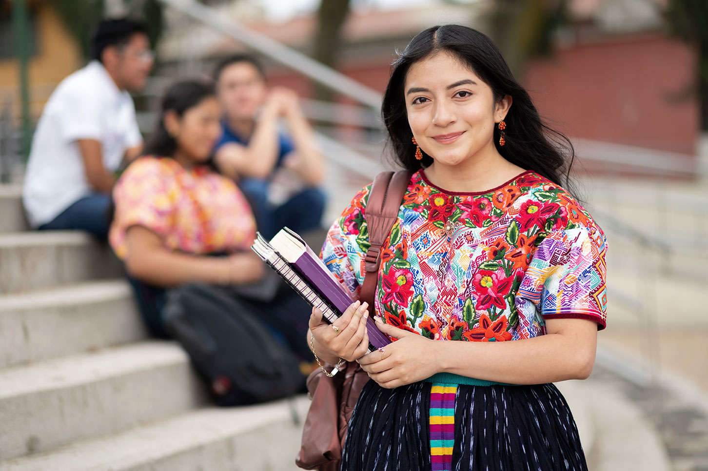 Student with books. Image courtesy of Adobe Stock
