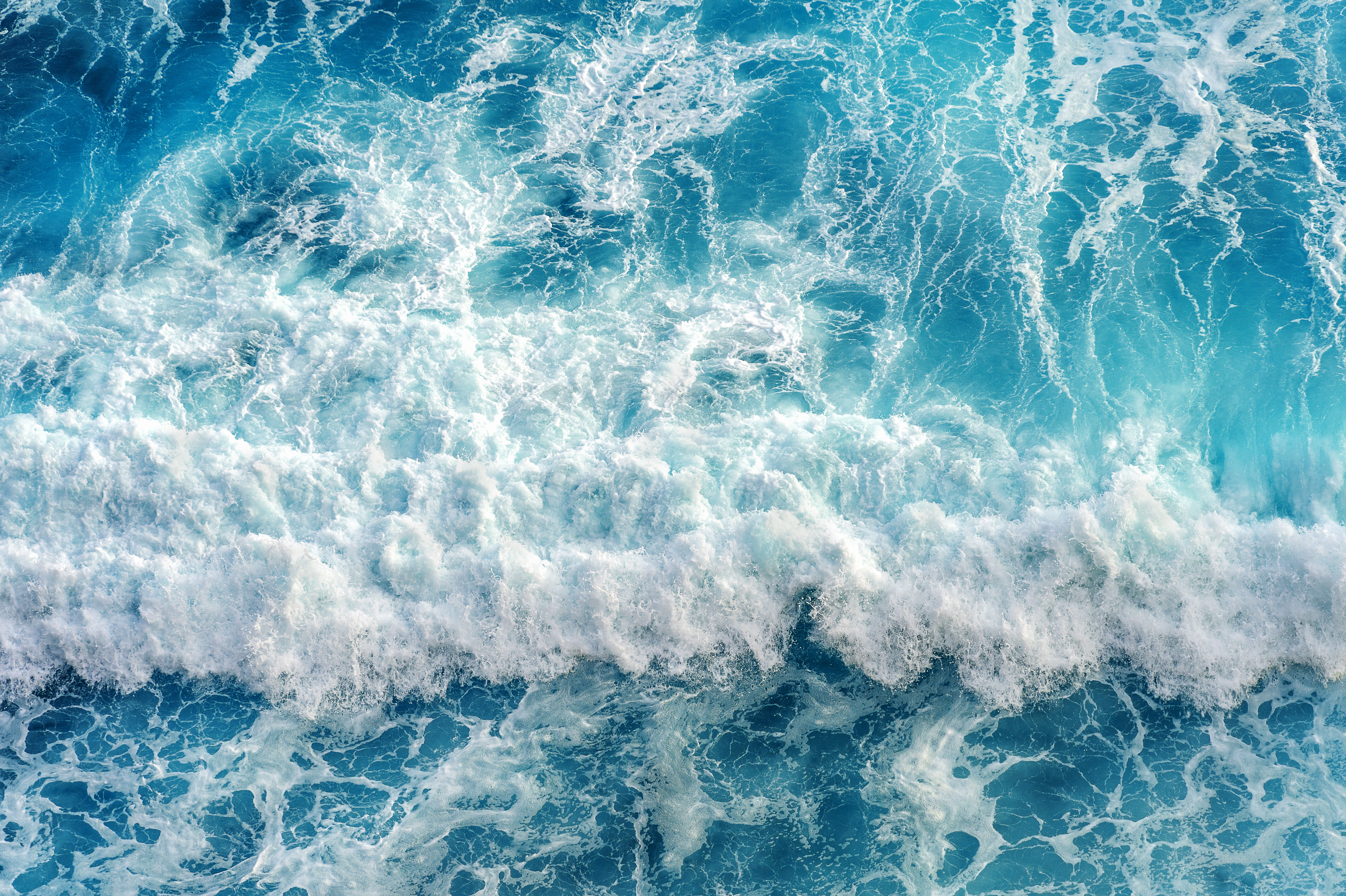 Aerial view of the ocean wave. Image courtesy of Adobe Stock. 