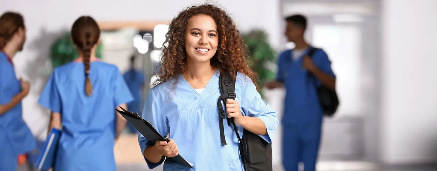 Image of college students in hallway, courtesy of Adobe Stock