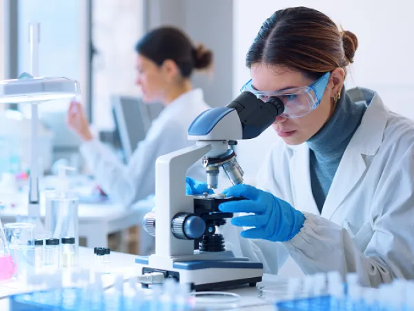 Researcher in lab. Image courtesy of Adobe Stock. 