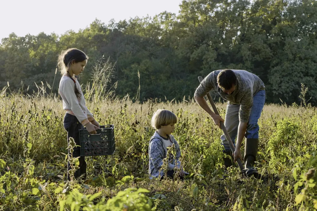 Image of farming family in field courtesy of AdobeStock