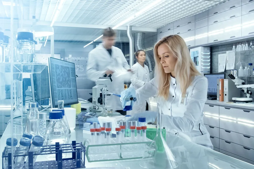 People working in lab courtesy of AdobeStock