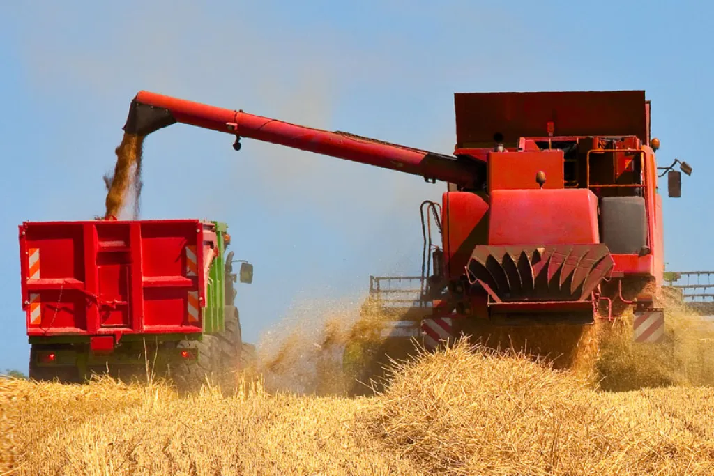 Image of combine in wheat field courtesy of Adobe Stock