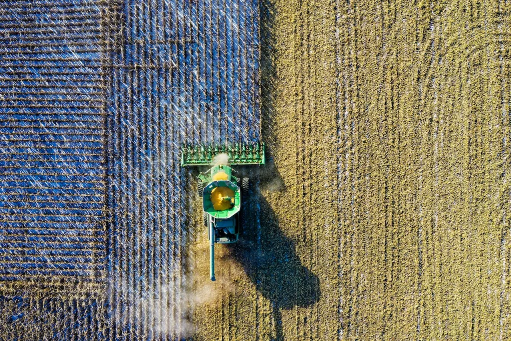 Photo: Tom Fisk | Pexels Aerial shot of green milling tractor.