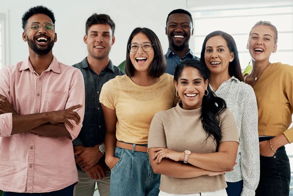 Group of young adults smiling for camera, courtesy of Adobe Stock