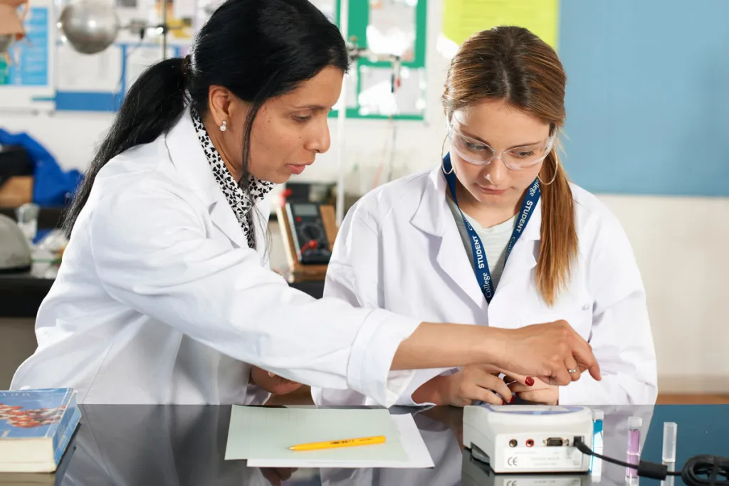 Teacher and student in lab, courtesy of Adobe Stock