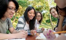 Multiethnic group of smiling young students studying, courtesy of AdobeStock