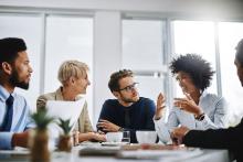A group of colleagues in a brainstorming discussion. Image courtesy of Adobe Stock.
