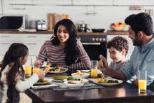 Image of family at dinner table, courtesy of Adobe Stock