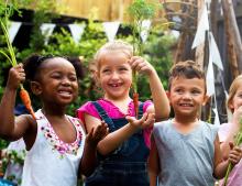 Image of children holding vegetables, courtesy of Adobe Stock