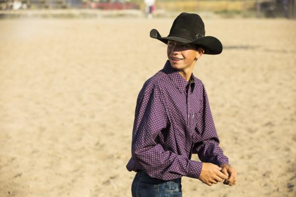 Photo of a young cowboy in a cowboy hat by Diane Diederich, courtesy Getty Images.